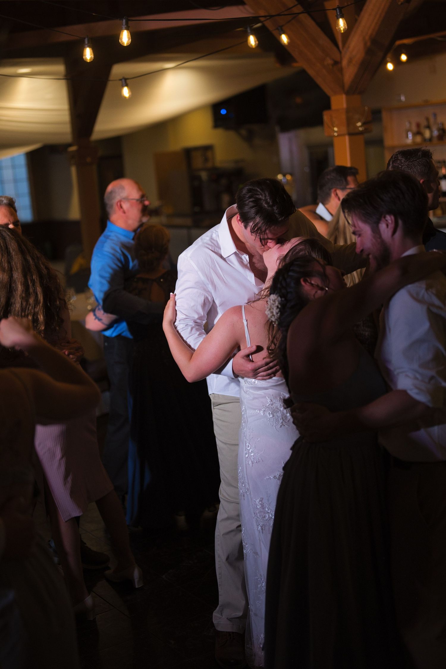 Newlyweds kissing on the dancefloor