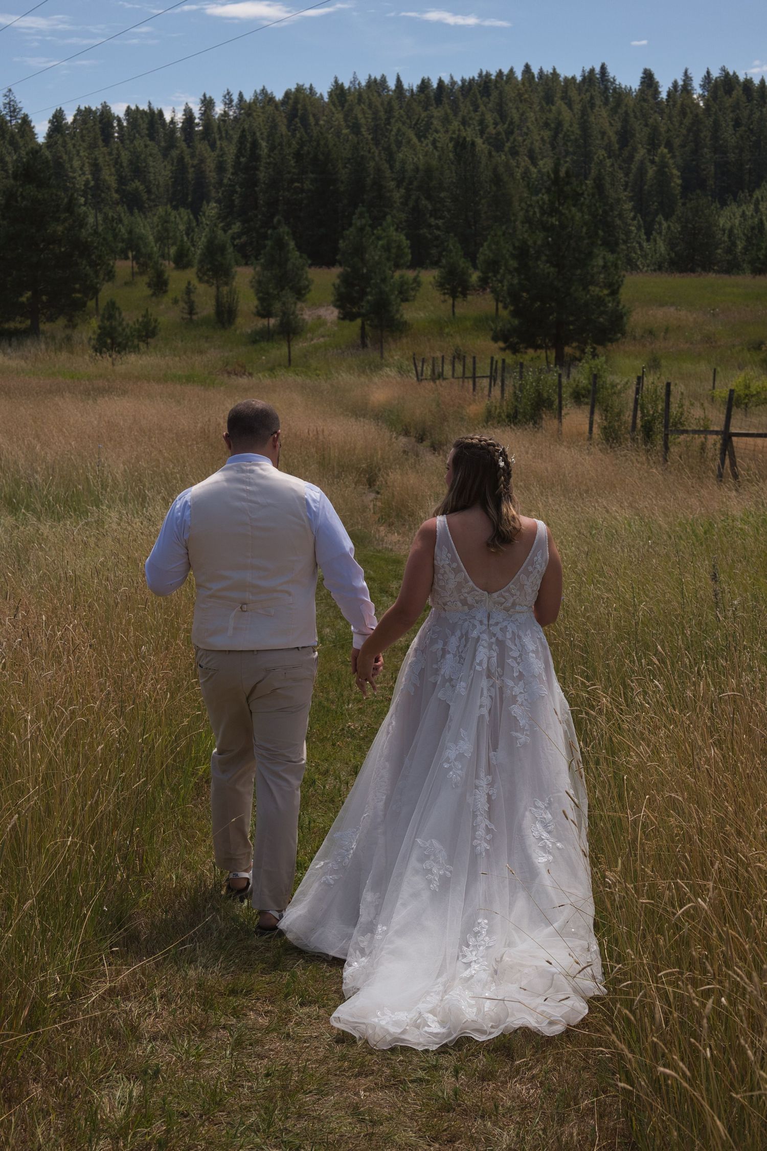 Candid moment of couple holding hands leaving wedding ceremony