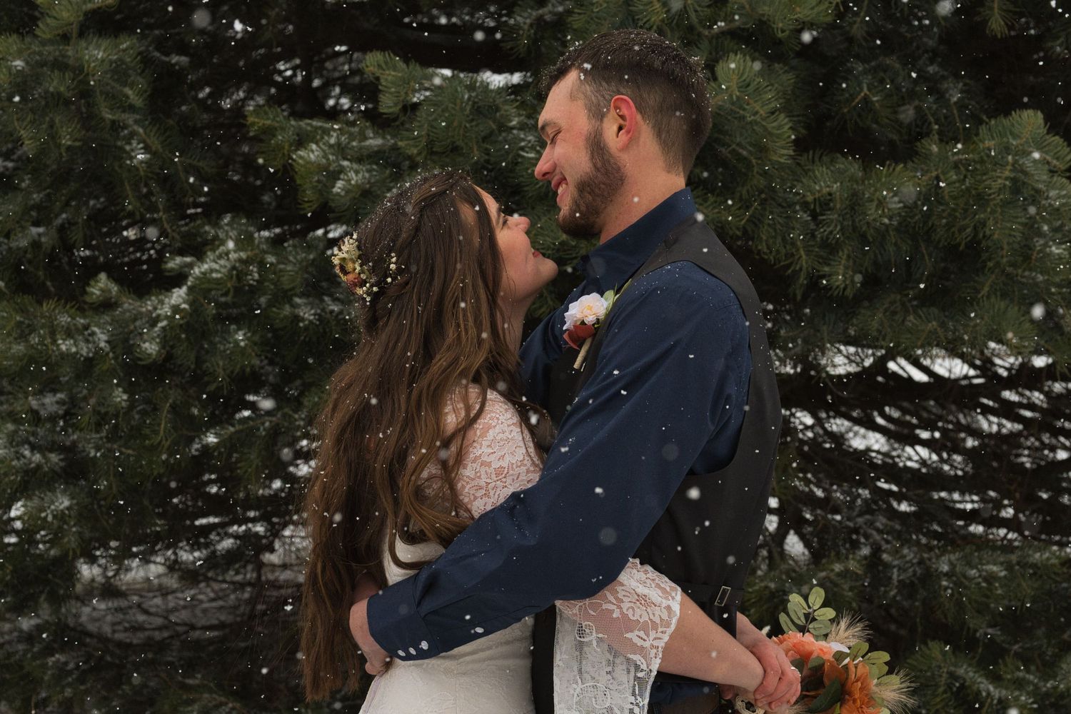 Couple holding each other during first look in Sandpoint