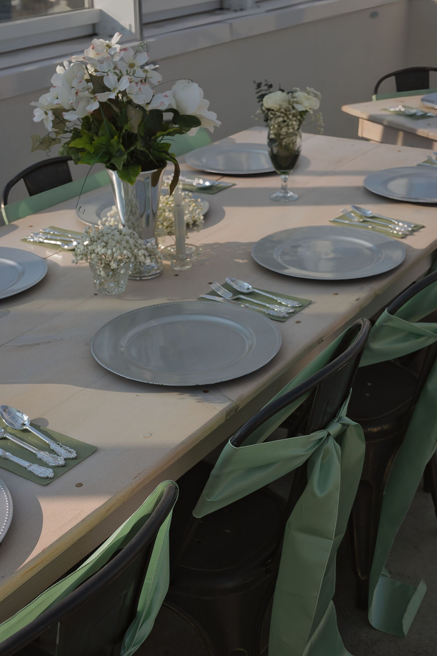 Place settings in greenhouse wedding venue in Eastern Washington