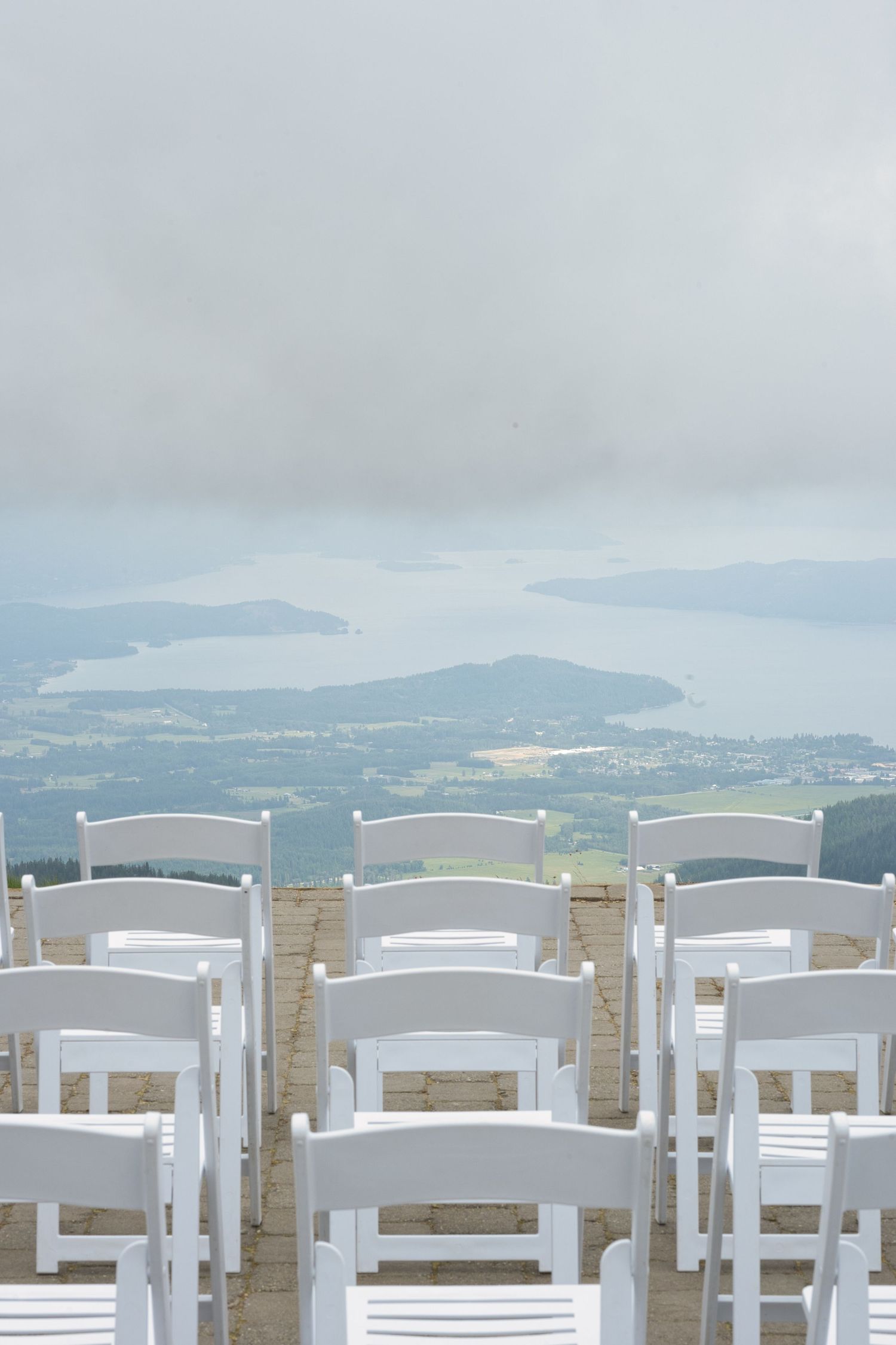 Chairs set up for wedding ceremony looking over lake view