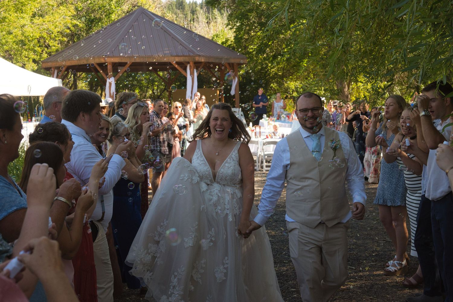 Married couple walk through bubbles as they exit in Moscow, Idaho