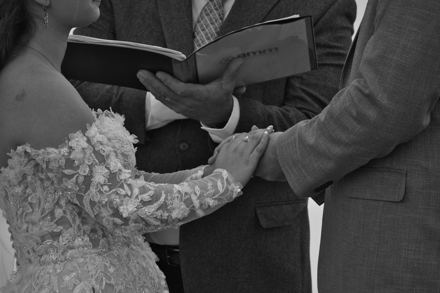 Close up of bride and grooms hands during wedding ceremony