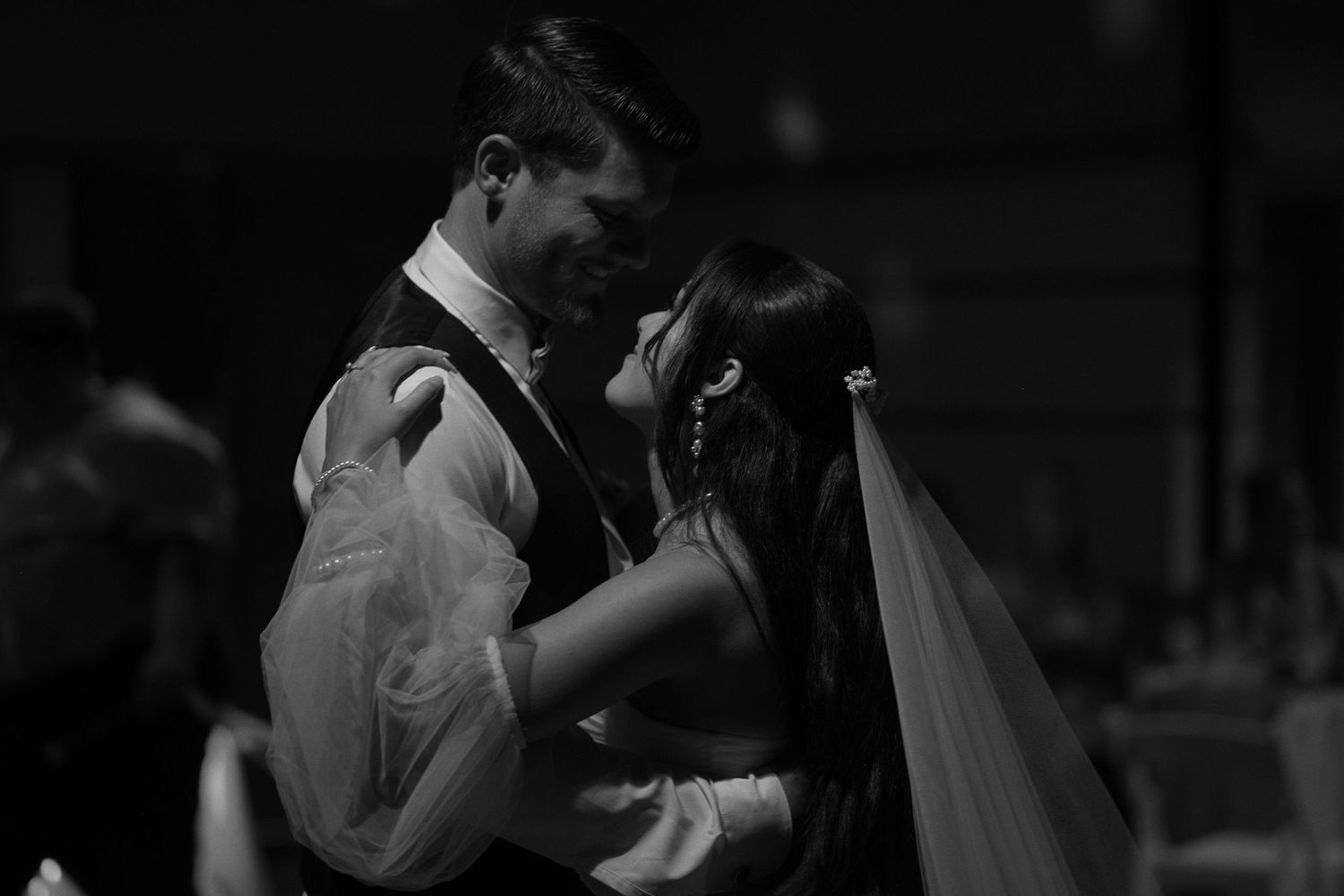 Candid moment of couple holding each other during dancing