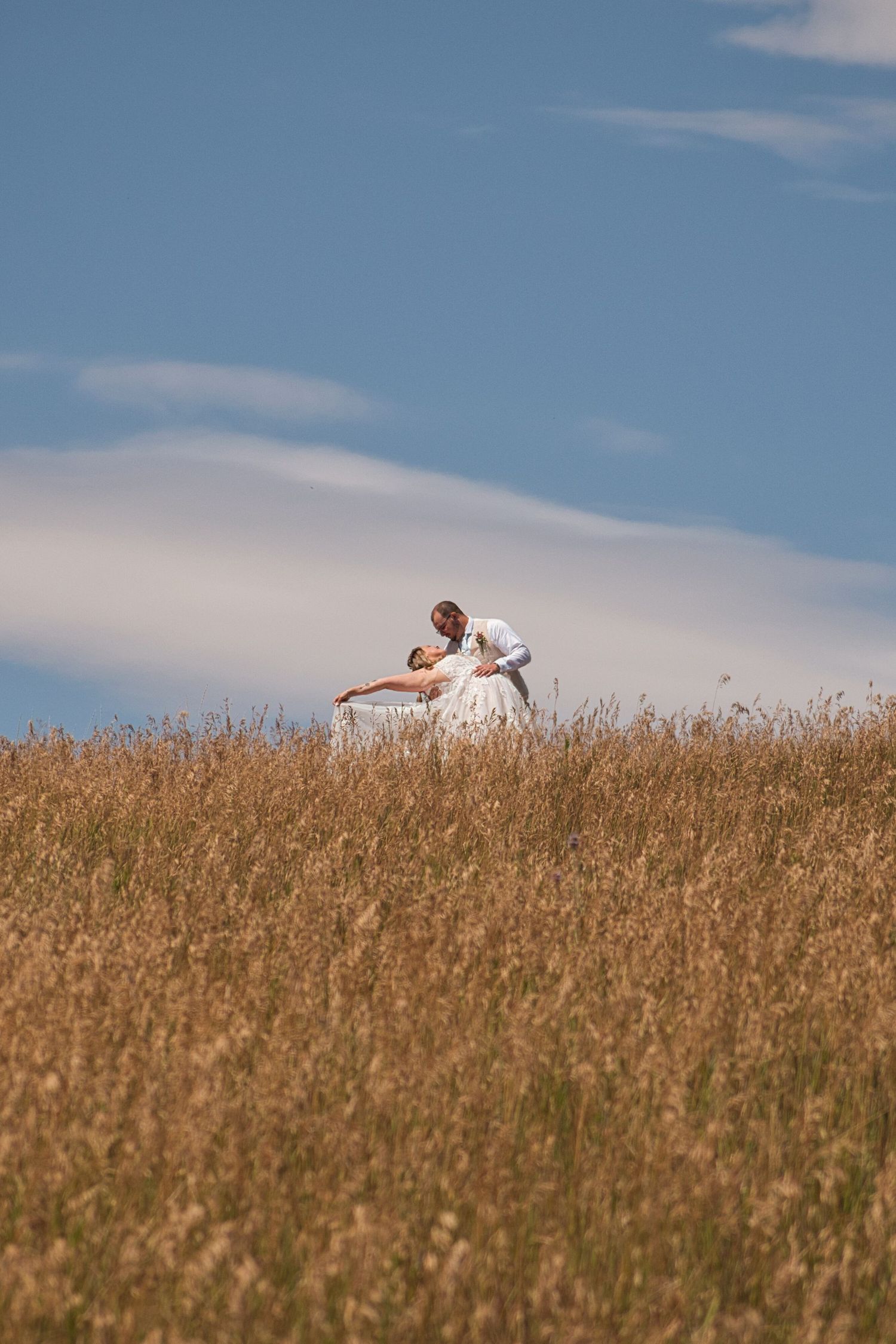 Couple kiss at the top of a field in Moscow, Idaho