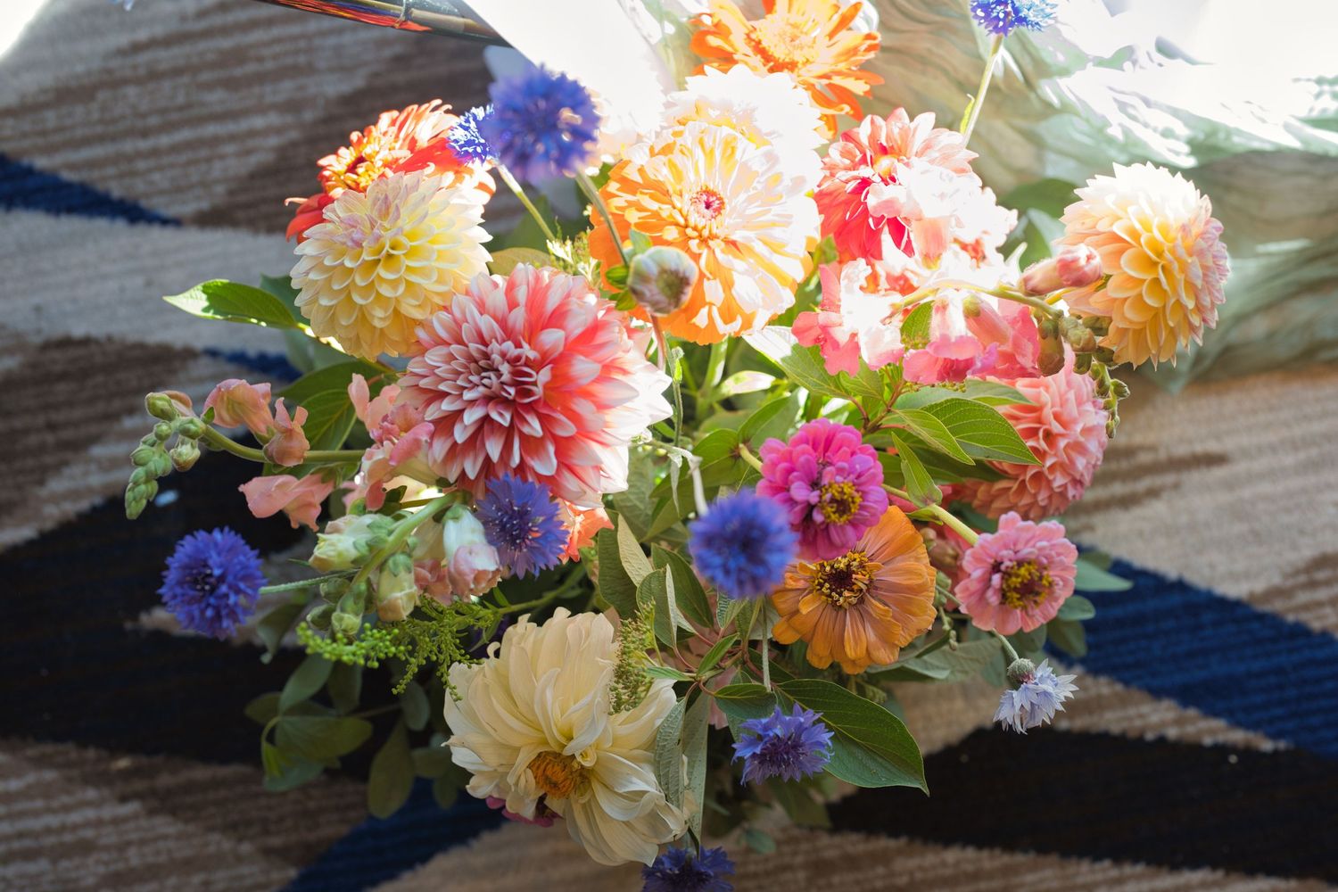 Vibrant flowers shine in a beam of sunlight in a wedding in the Coeur d' Alene Resort in North Idaho.