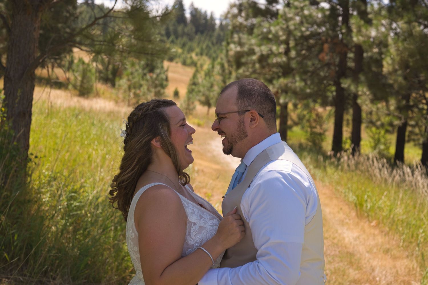 Candid moment of couple laughing during wedding couples photos