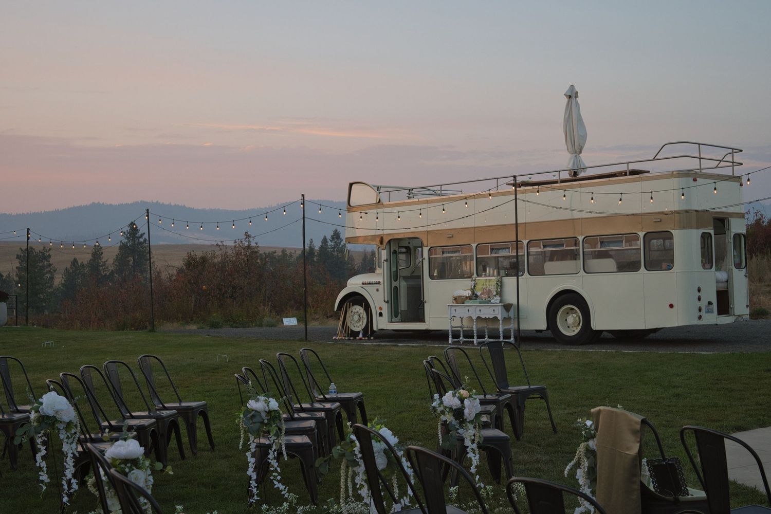 Wedding venue featuring old van with mountains in the distance