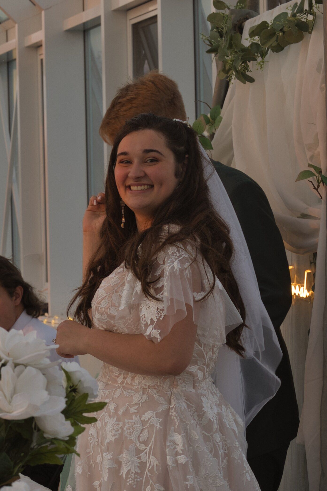 Candid photo of bride smiling at the camera