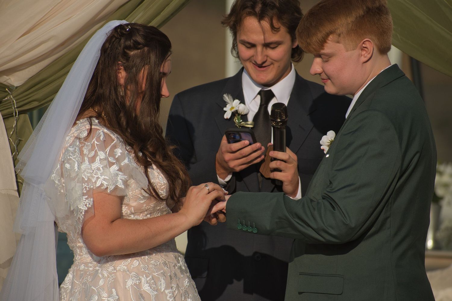 Couple exchanging rings during wedding ceremony in Eastern Washington