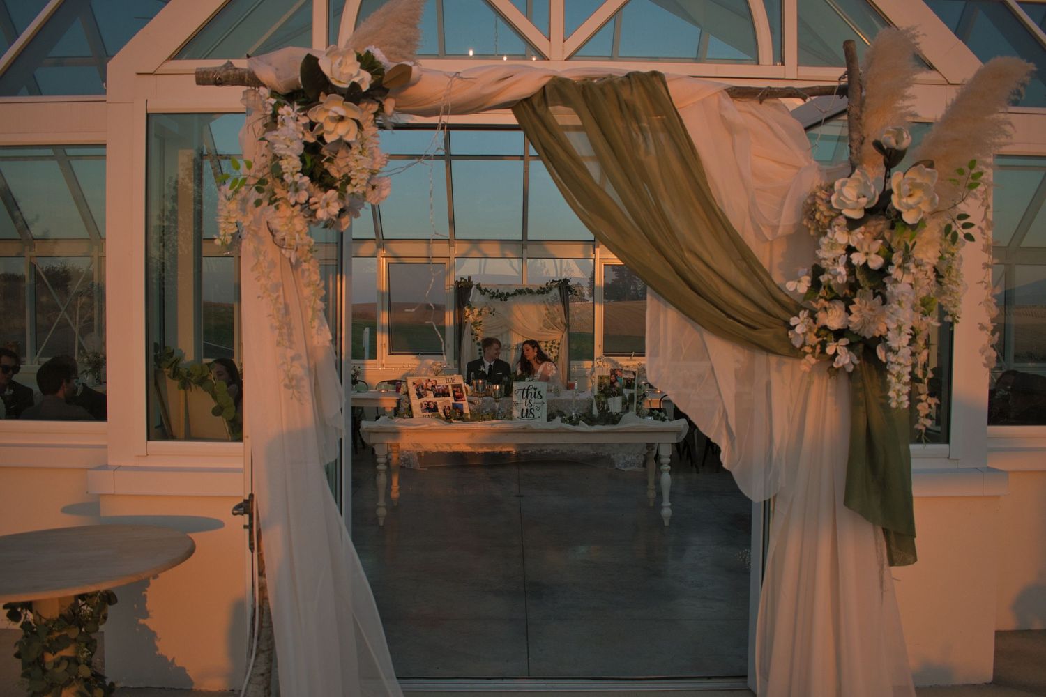 Candid peek of bride and groom during wedding reception