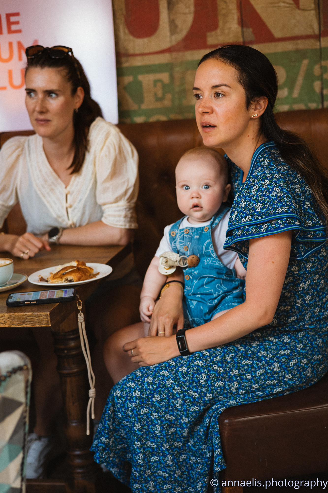 Family gathering in casual restaurant setting with vintage decor.