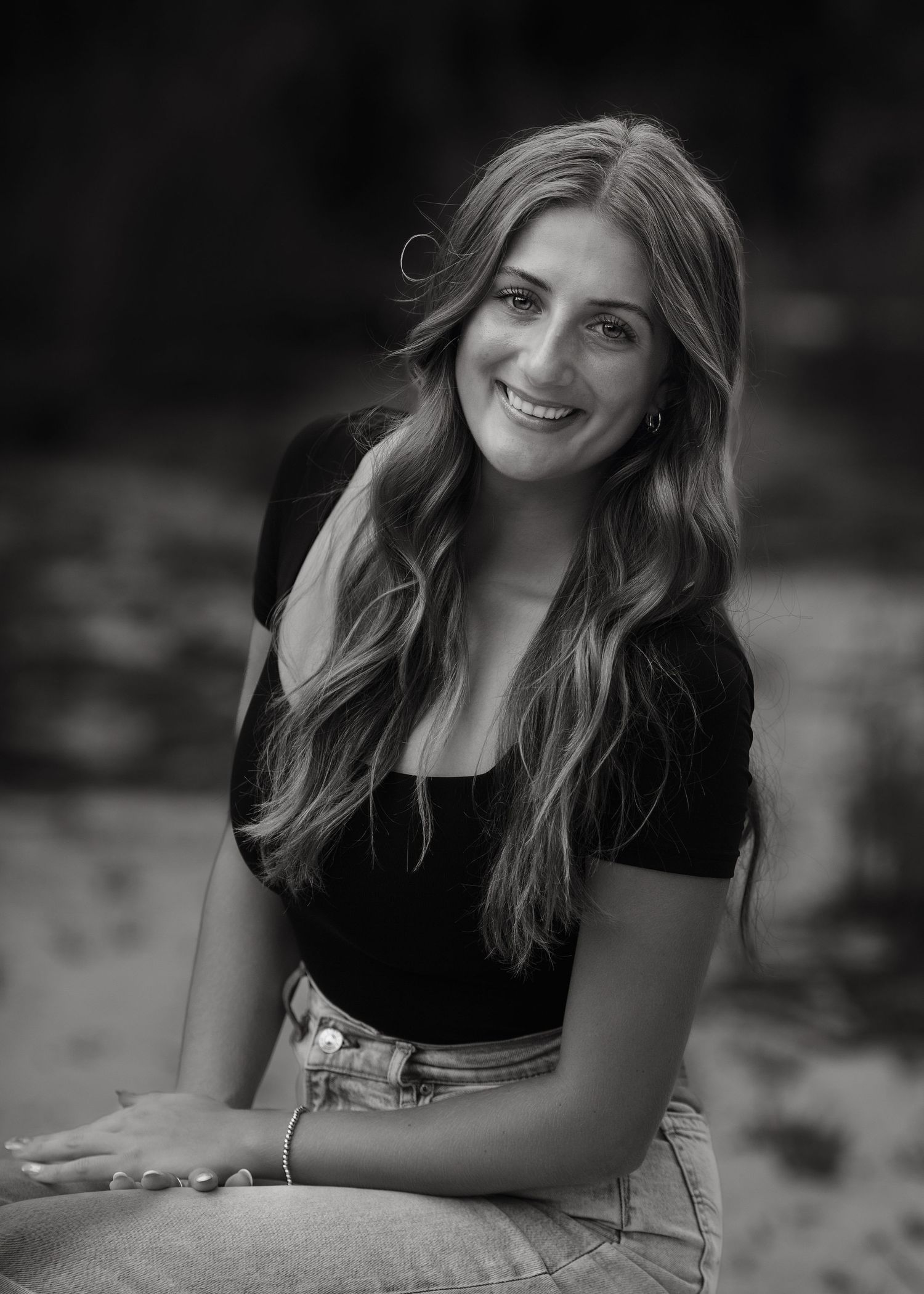 Black and white candid portrait showing natural joy and laughter.