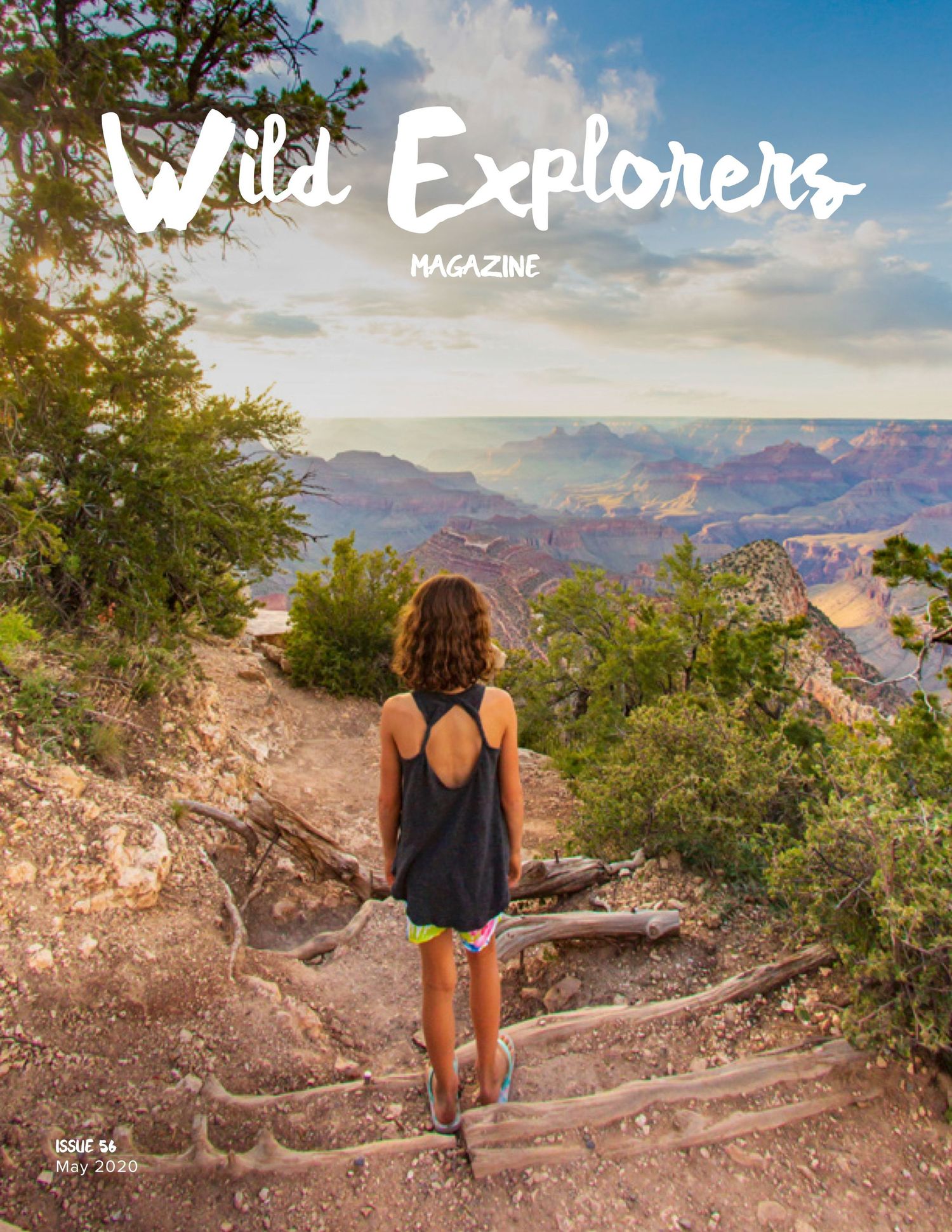 Person overlooking vast Grand Canyon vista at sunset for Wild Explorers magazine cover.