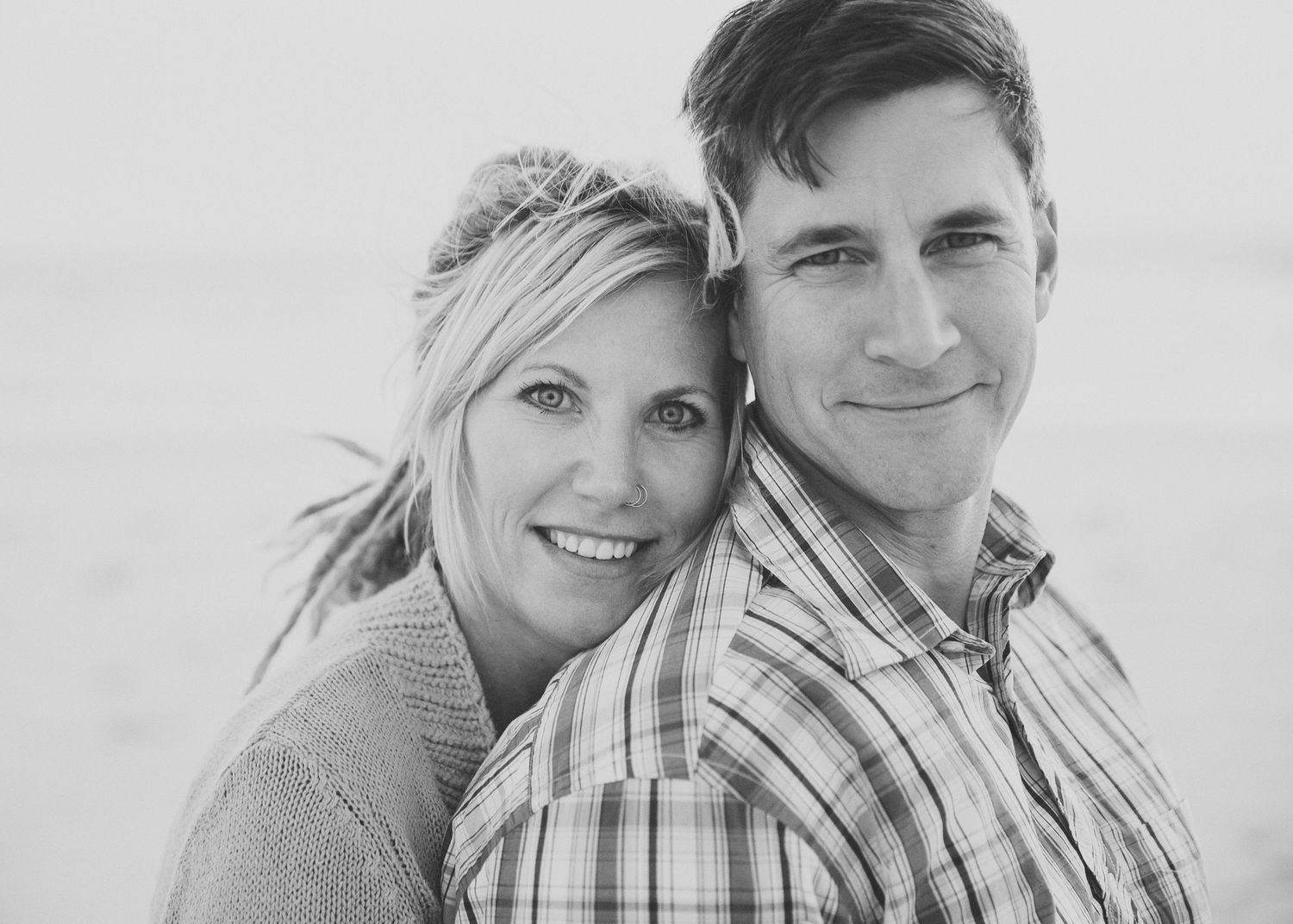 Close up portrait of couple in casual attire.