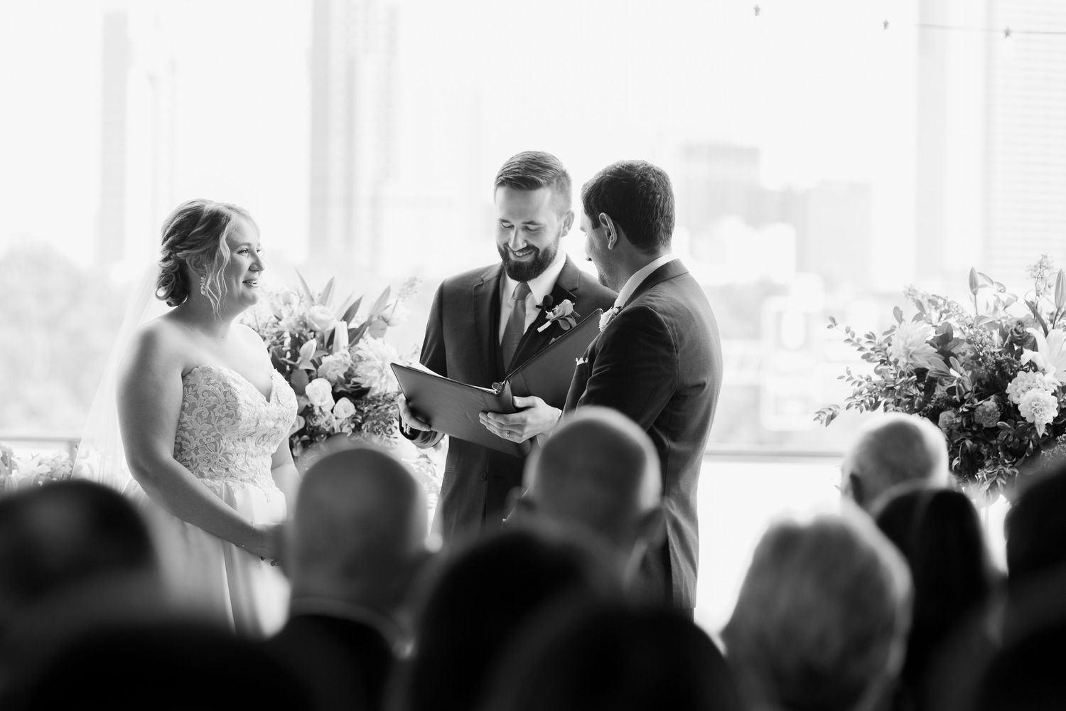 Black and white photo montage of wedding ceremony moments showing guests and couples during a celebration.