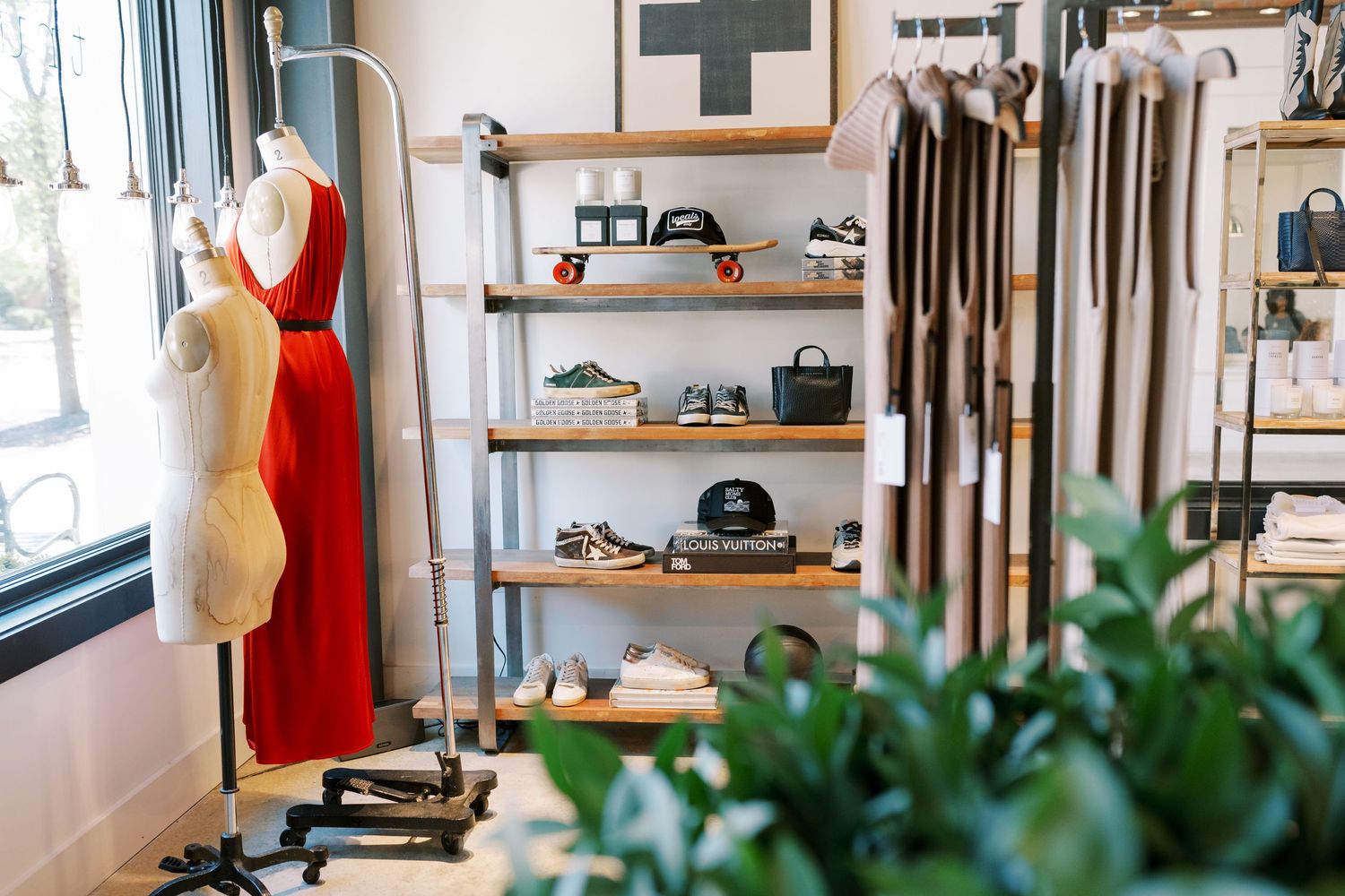 Modern retail interior with shelving displays and natural lighting.