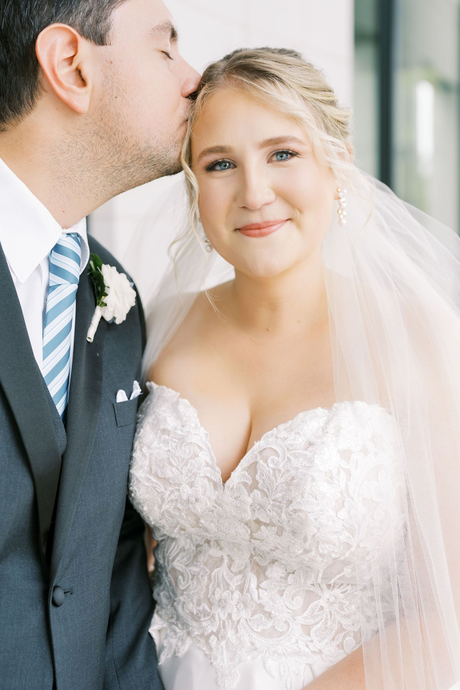 A romantic wedding portrait series showing tender moments between a bride in lace and groom in a striped tie.