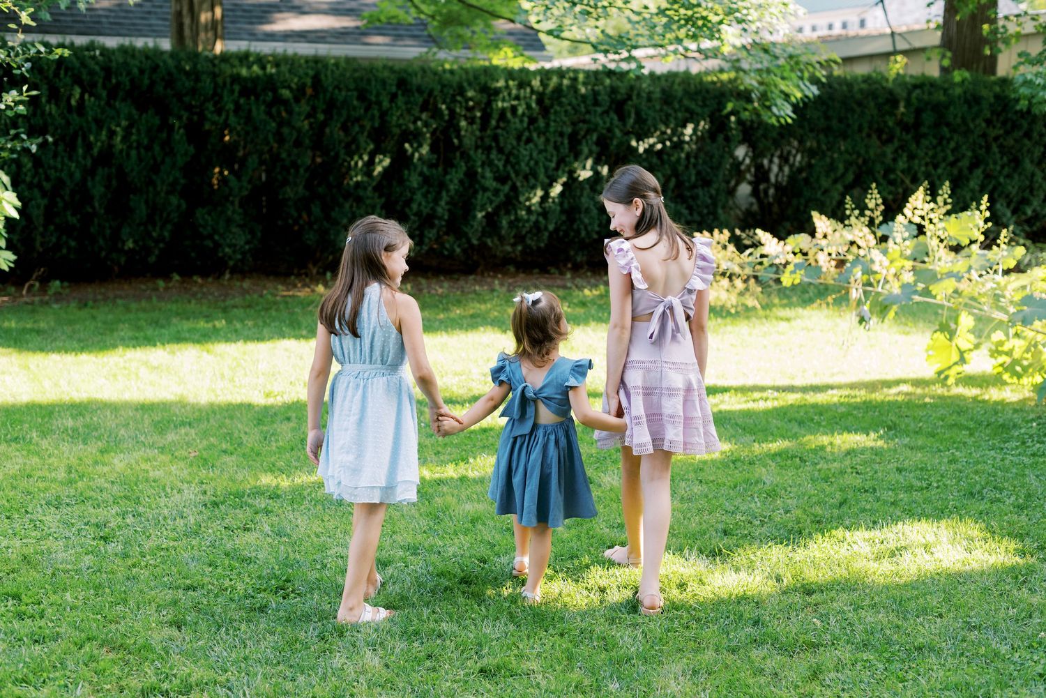Multiple views of a family photo session in a park setting with natural greenery.