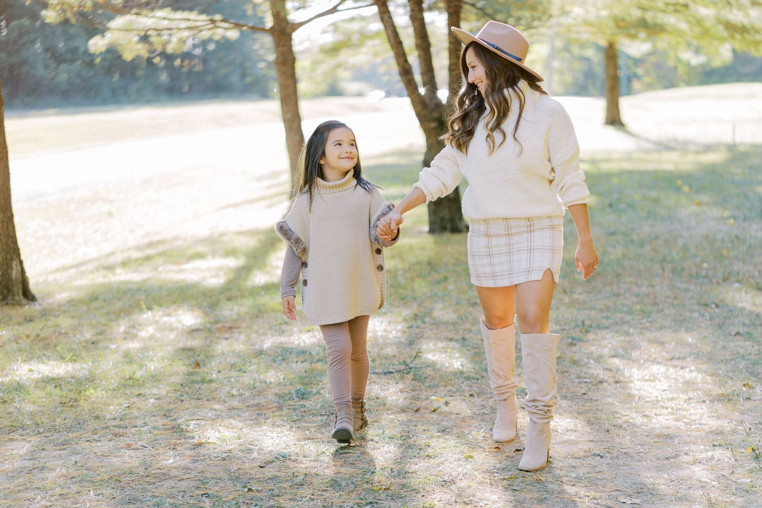 Candid outdoor family photoshoot sequence in a sunlit garden setting.