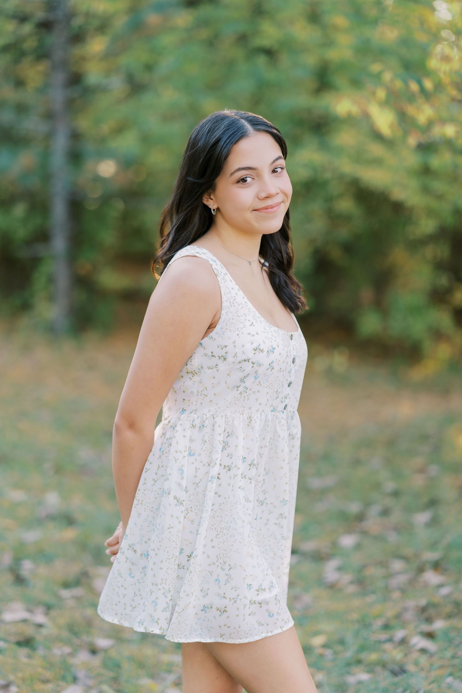 A sequence of outdoor portraits showing someone in a white lace top against a blurred autumn background.