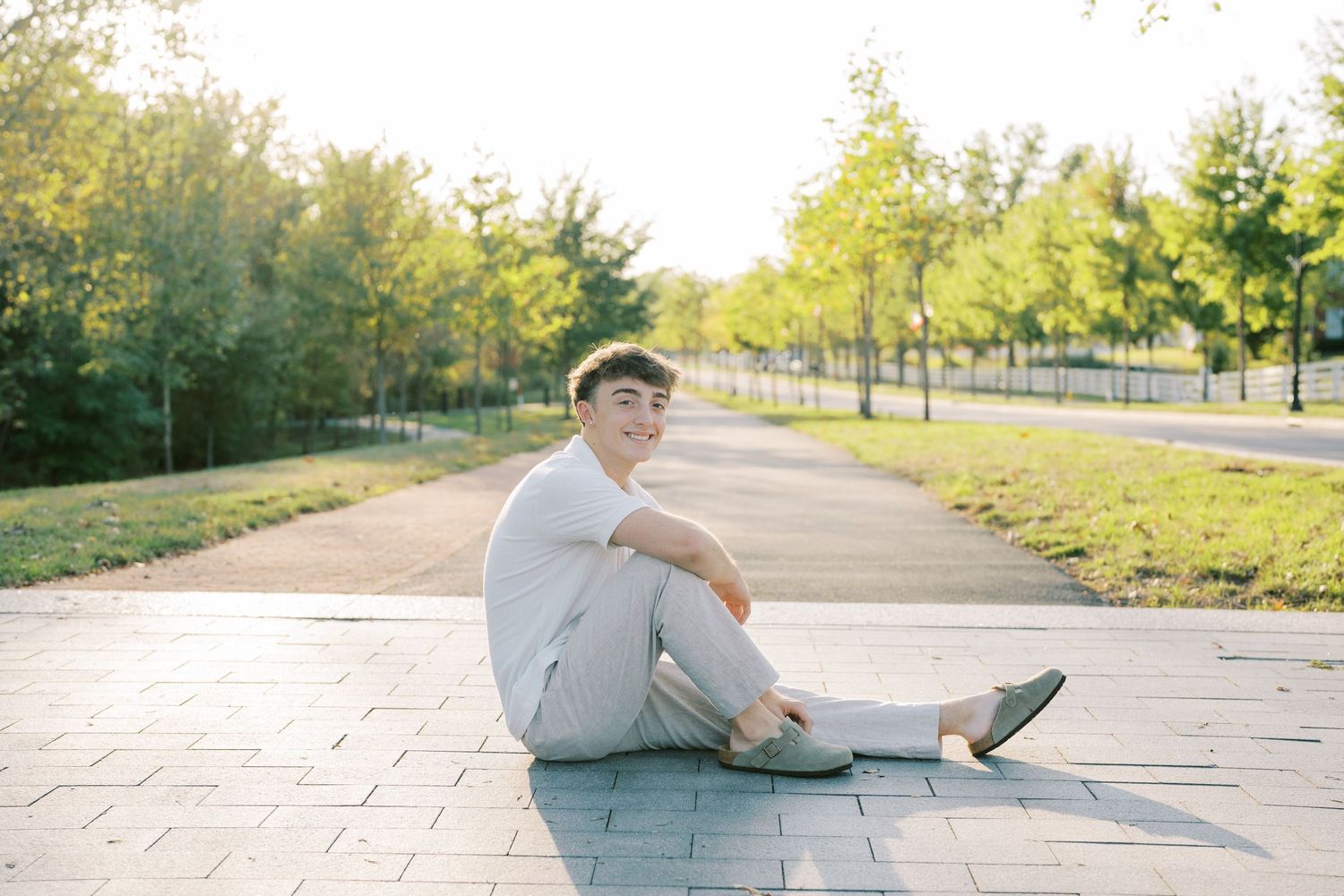 A sequence of photos showing someone stretching on a concrete path surrounded by autumn trees and grass.