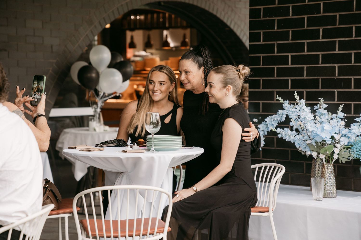 Wedding guests posing during a Brisbane wedding reception.