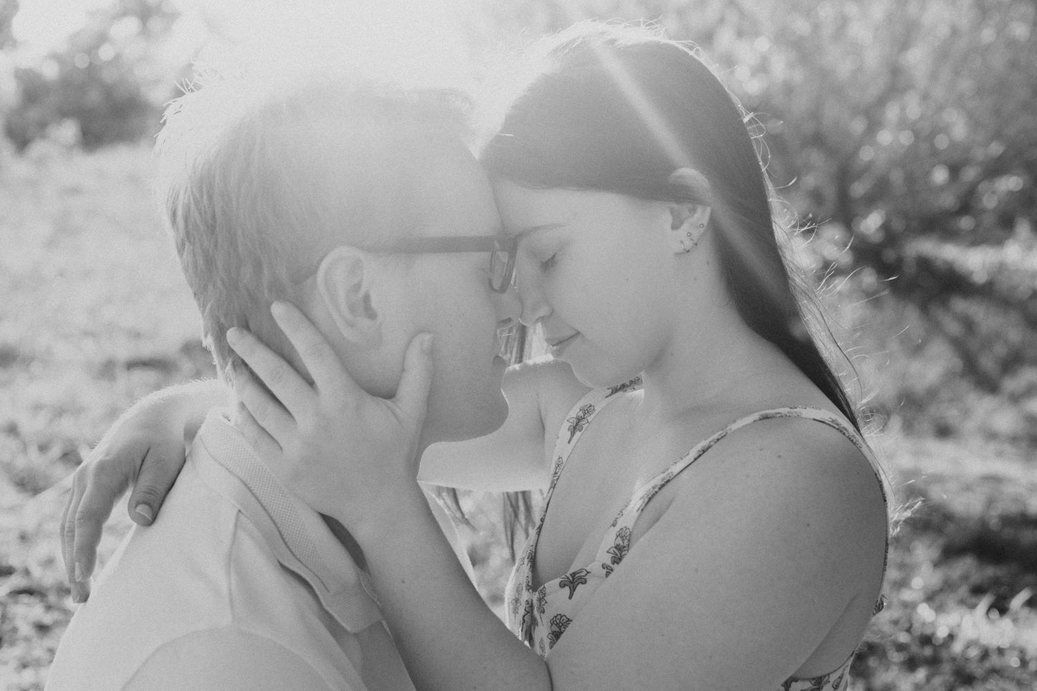 Couple sharing a quiet moment during an outdoor photography session.
