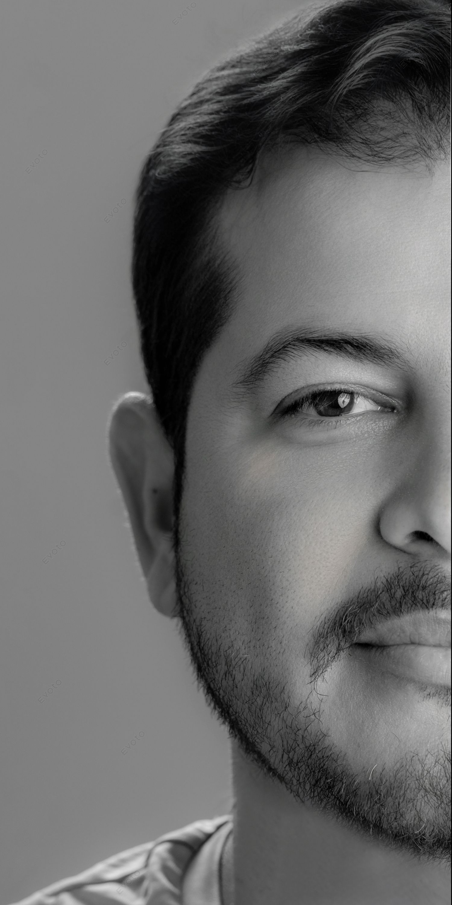 Black and white portrait series showing different angles of a bearded man's face against a plain background.