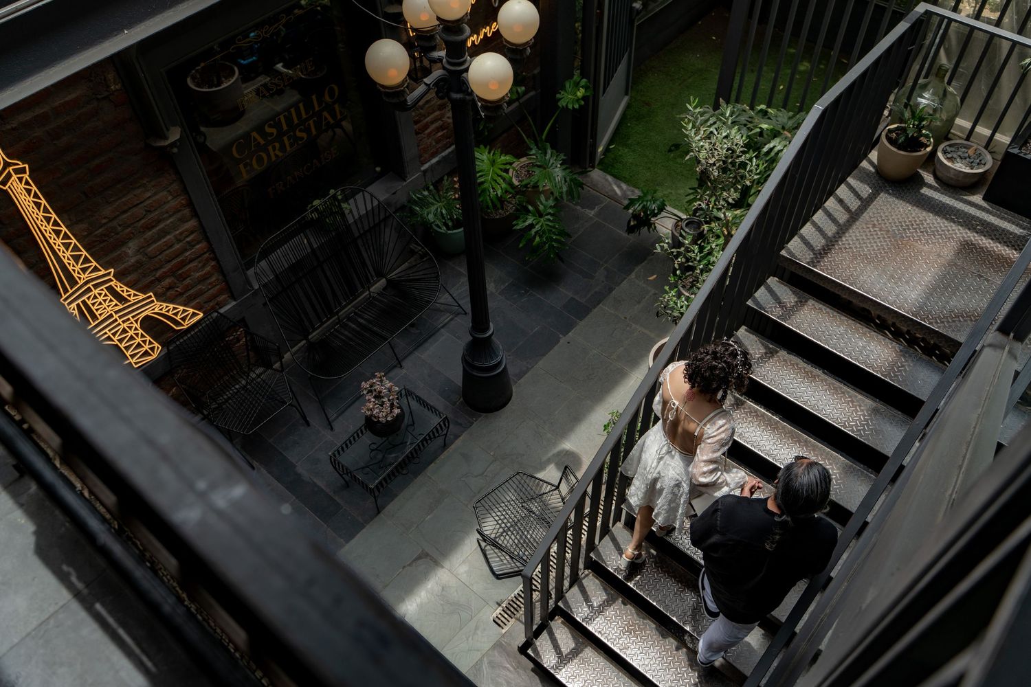 Outdoor staircase with string lights and decorative elements creating romantic ambiance.