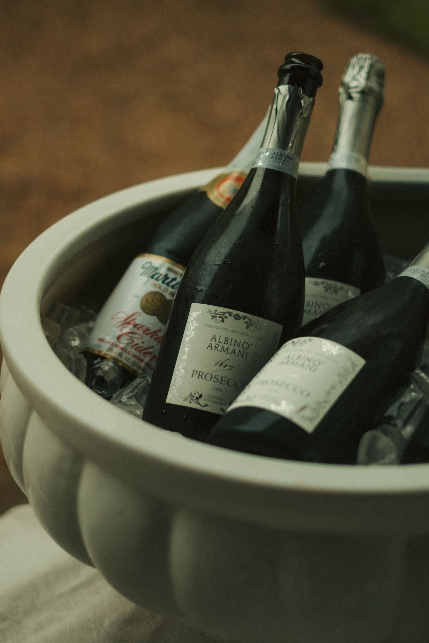 Bottles of Albino Armani Prosecco chilling in an ice bucket, perfect for celebrations and special occasions.