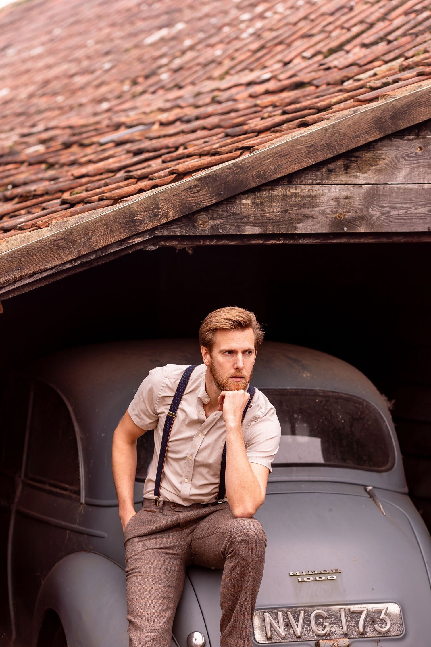 Vintage car photography series showing details of a classic automobile against a rustic backdrop.