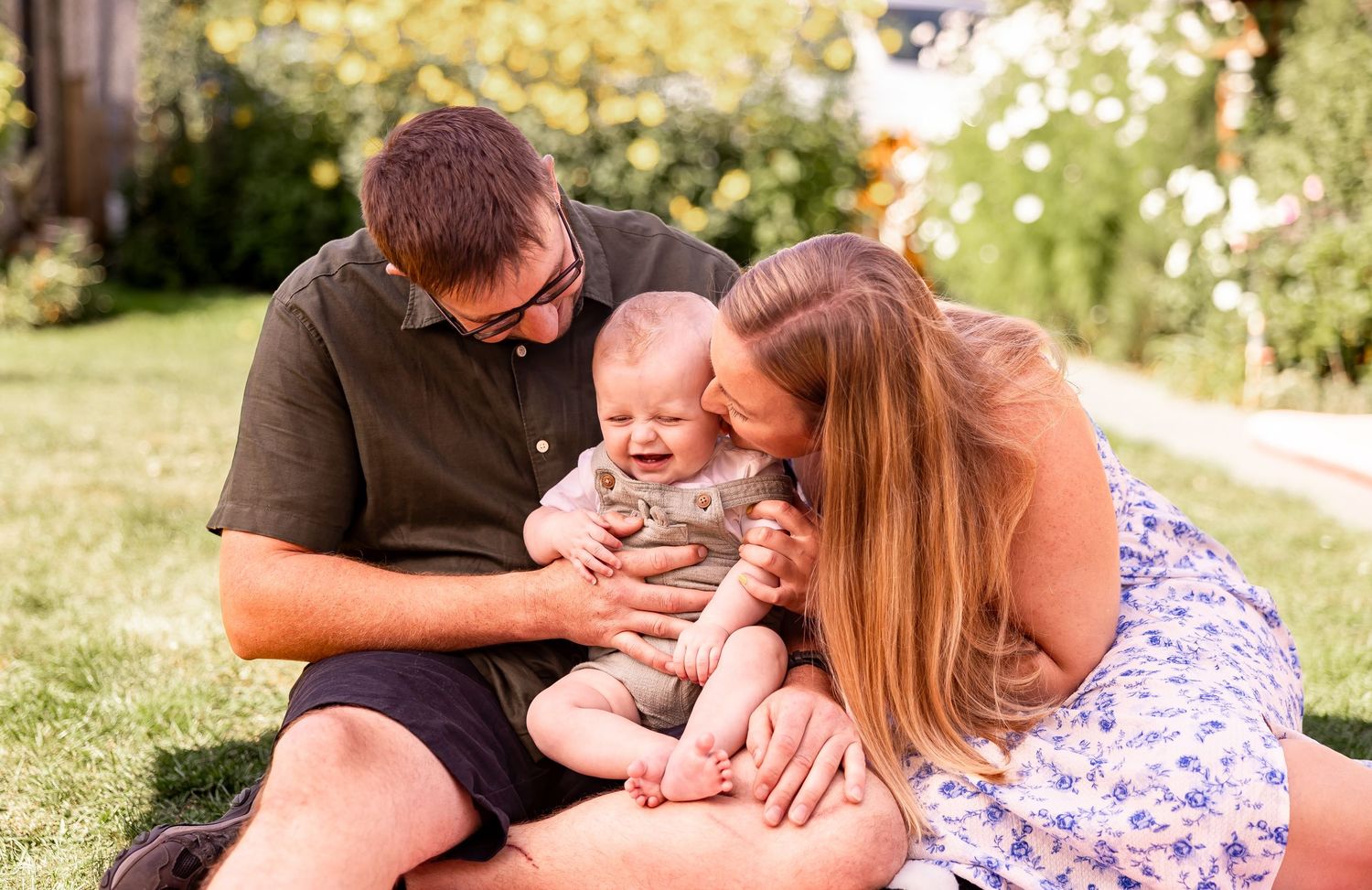 Playful outdoor family photoshoot sequence showing joyful interactions in summer sunlight.