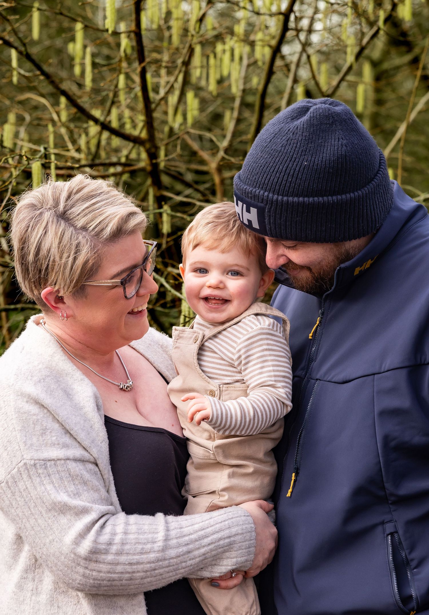 Tender family moment captured in a series showing affectionate interactions outdoors.
