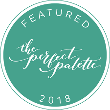 A circular green badge with elegant white script text reading 'The Perfect Palette Featured 2018'.