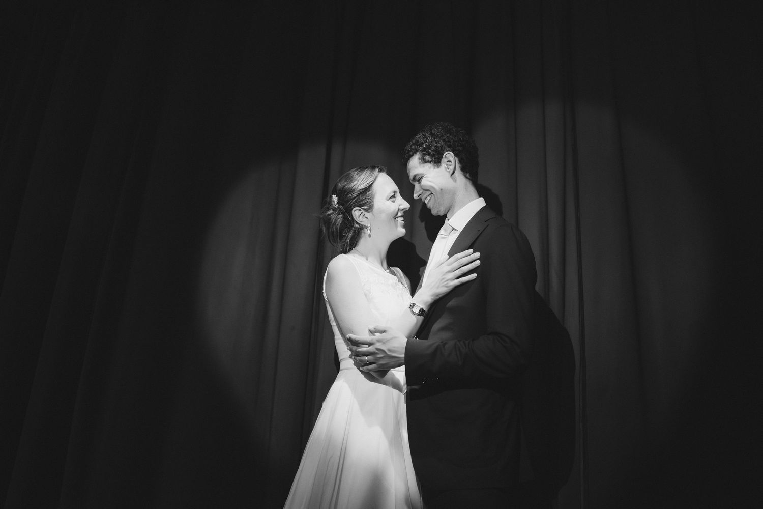 Dramatic black and white wedding portraits showing intimate moments.