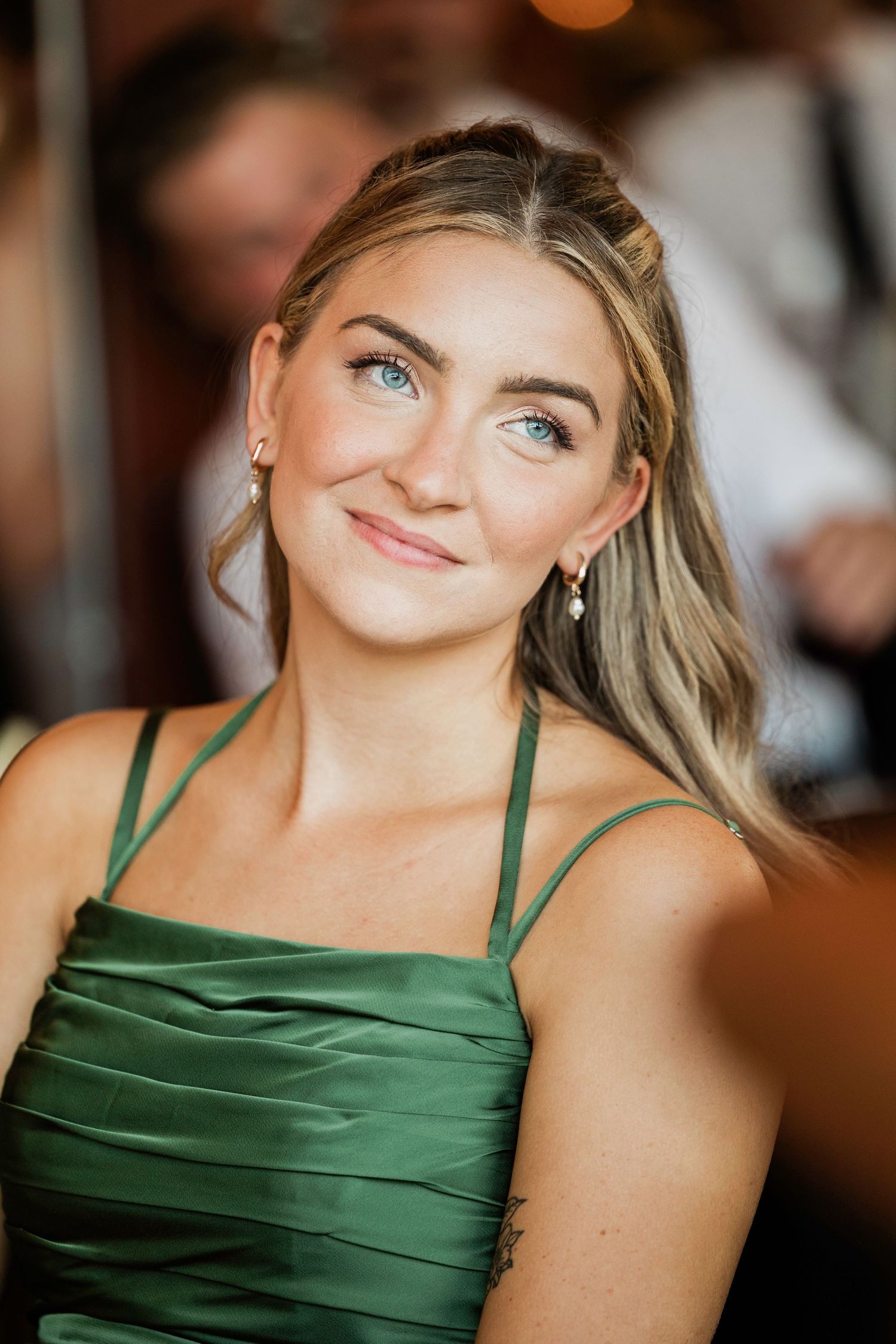 Series of close-up shots showing emerald green satin bridesmaid dress details.