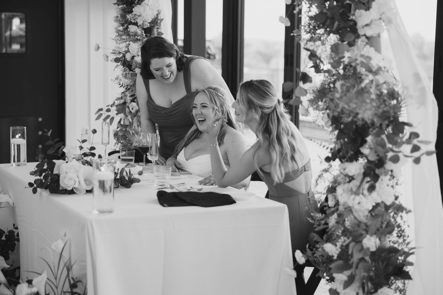 Black and white wedding reception photos showing guests enjoying festivities.