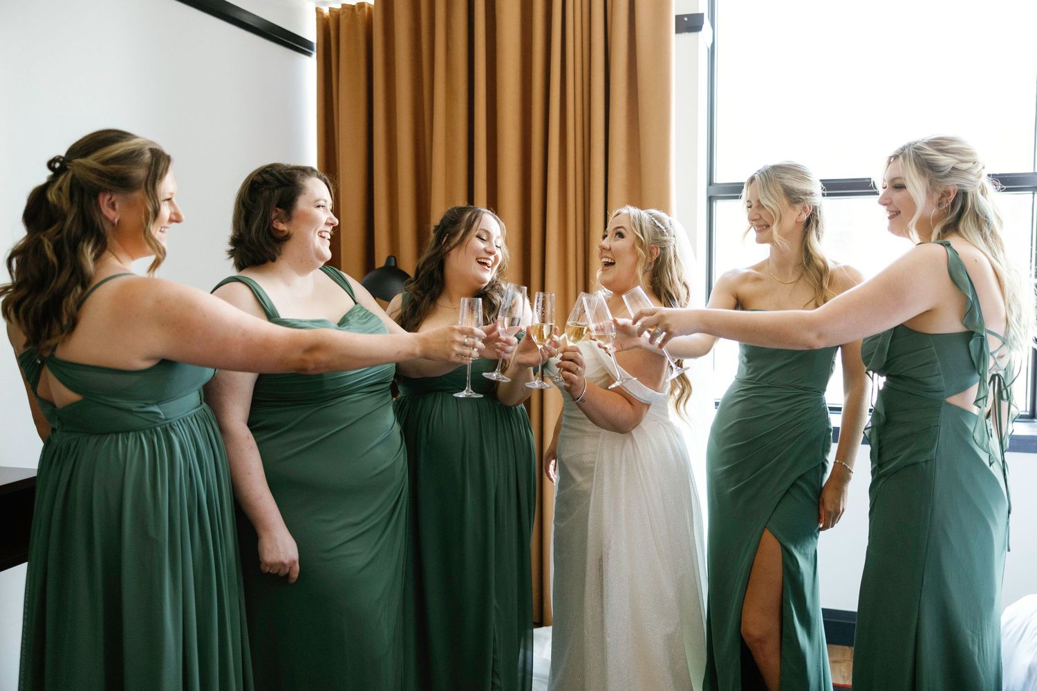 Row of elegant sage green bridesmaid dresses shown in a getting ready sequence.