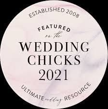 Circular pink badge featuring 'Wedding Chicks 2021' text with 'Ultimate Wedding Resource' tagline.