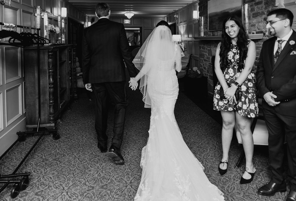 Black and white collage of candid wedding moments showing dancing and celebrations at a reception venue.