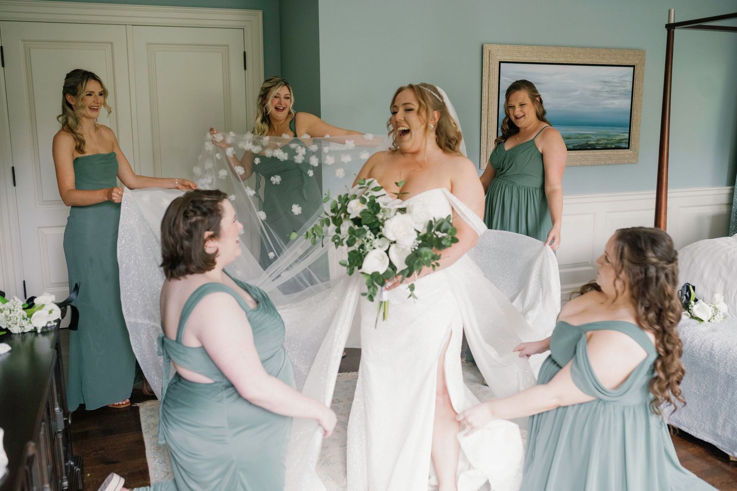 Wedding party members in sage green dresses share candid moments during preparations.