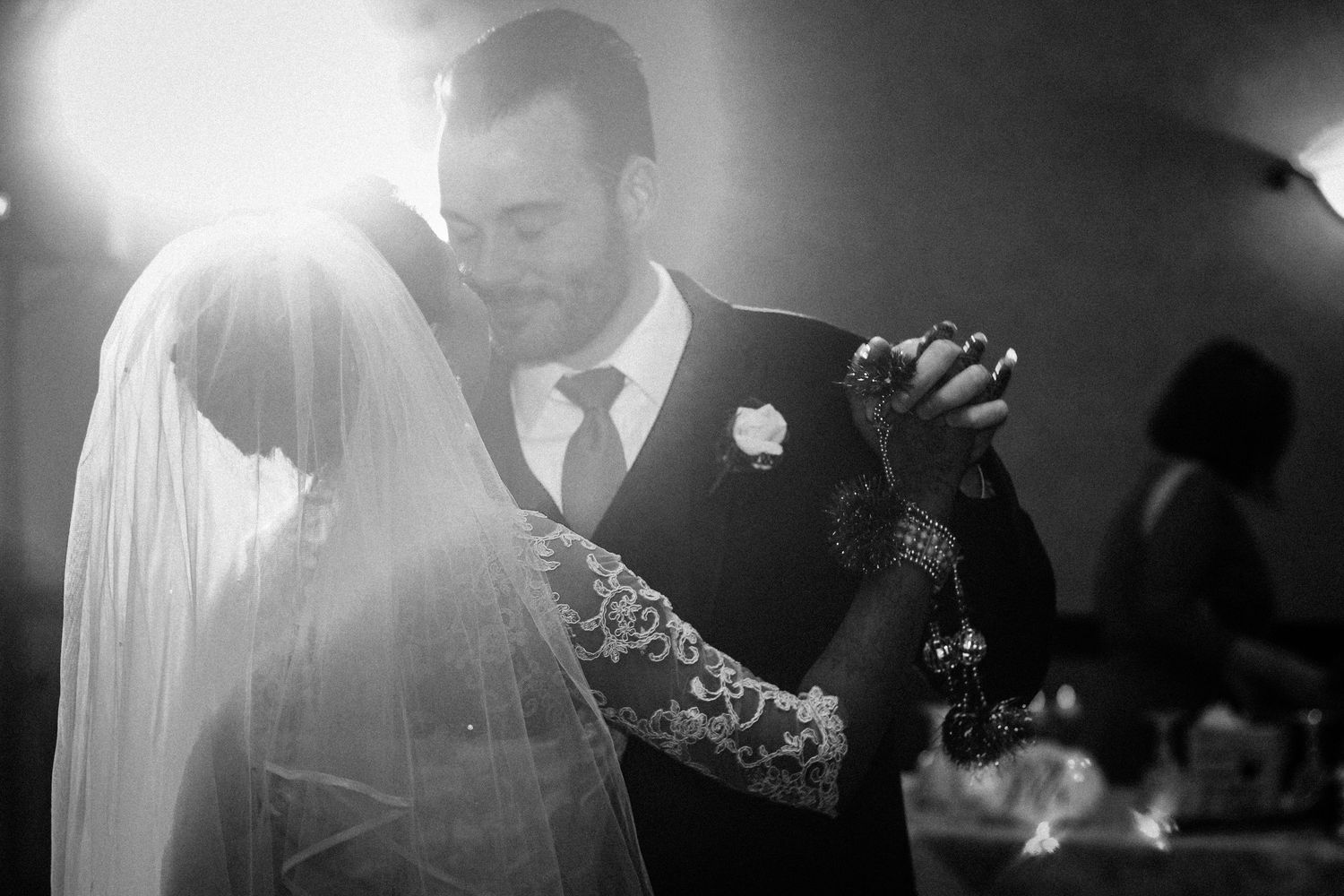 Artistic black and white wedding photography sequence with dramatic lighting.