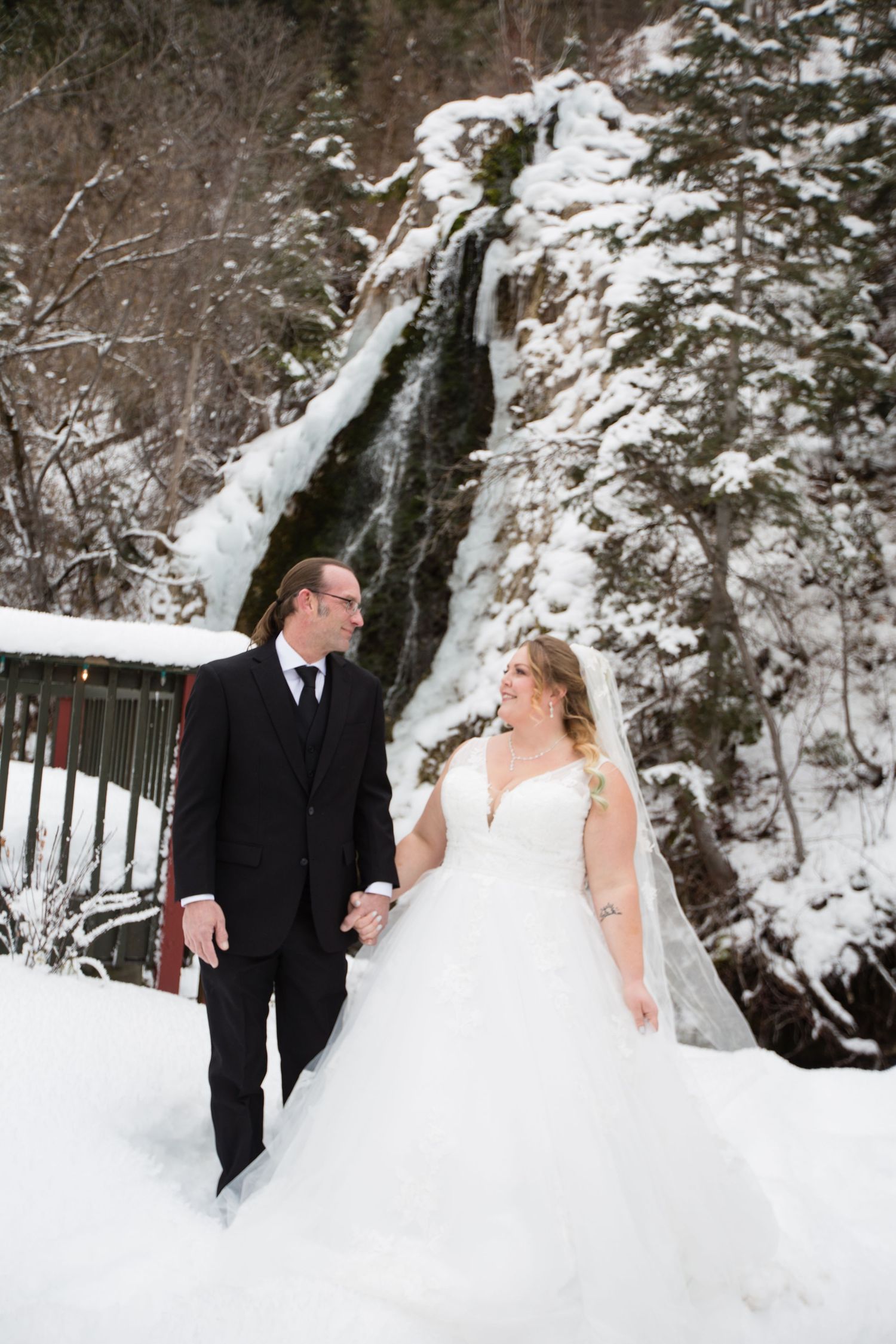 Elegant wedding photography session in winter wonderland setting.