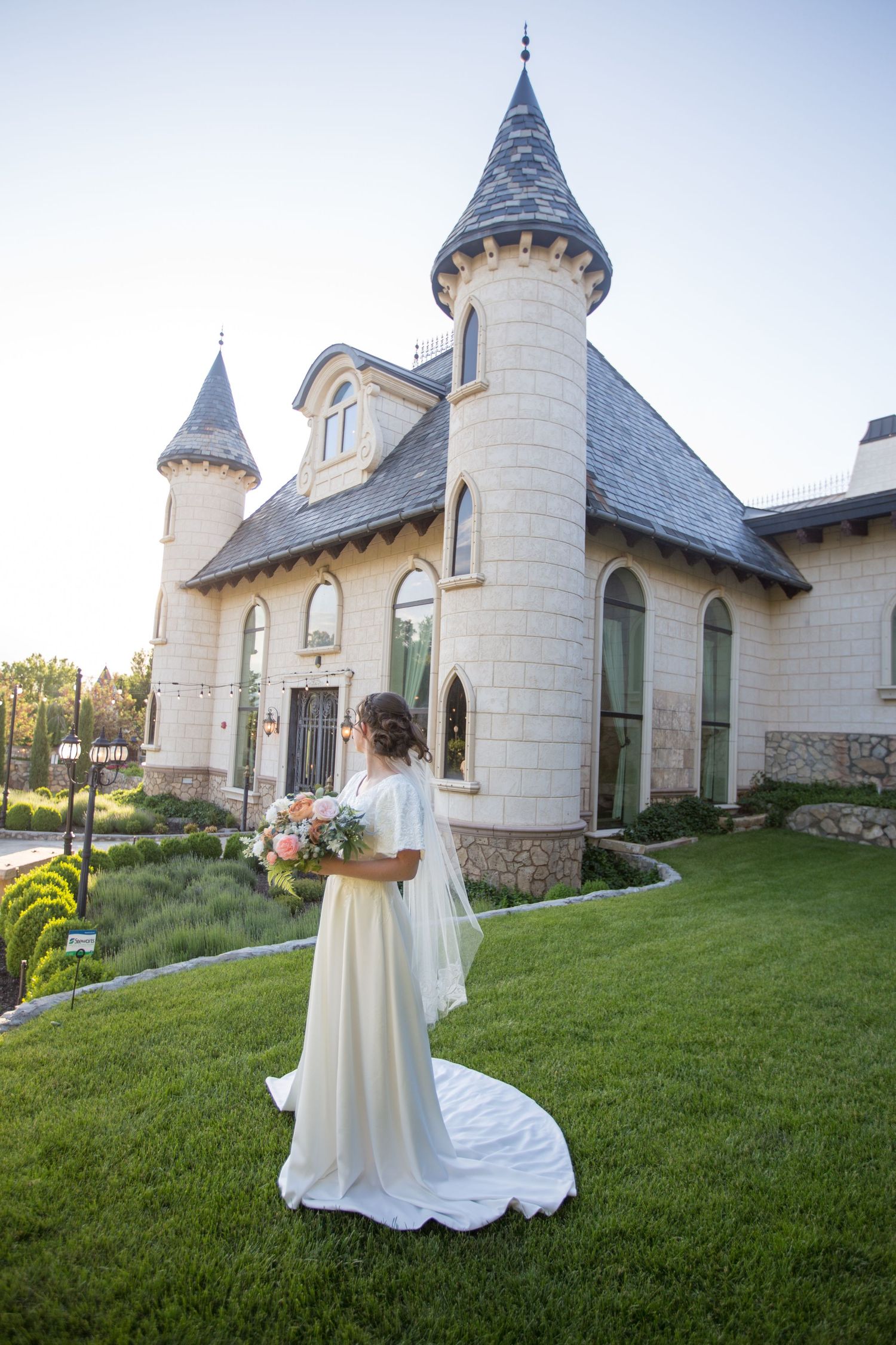 Wedding photo featuring Gothic-style chapel architecture and flowing white bridal gown.