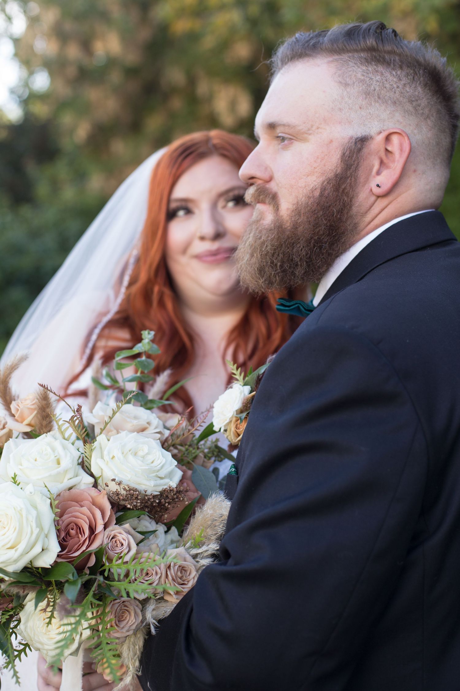A romantic wedding photo series showing a beautiful bouquet of white and dusty rose flowers against a natural backdrop.