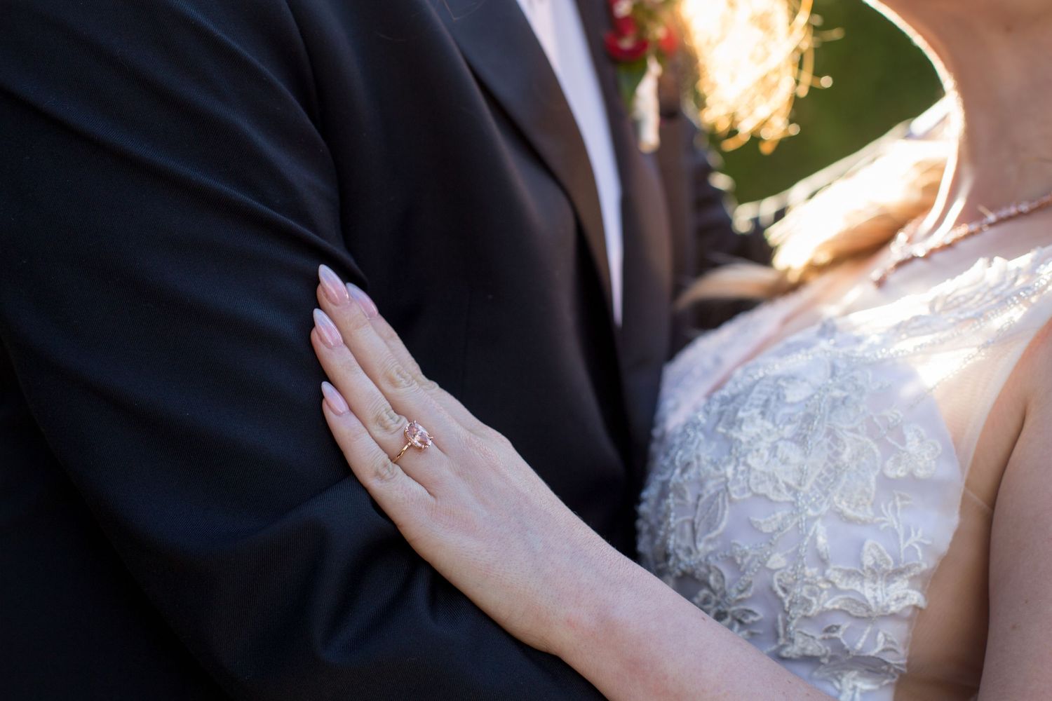 Close-up details of lace wedding dress and formal attire.
