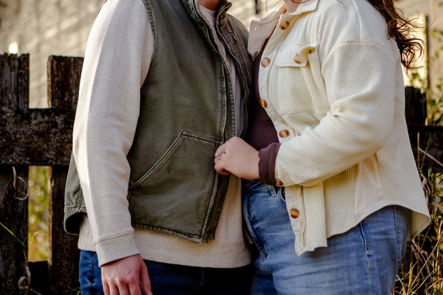 A couple embraces each other during fall photo session in Oconomowoc