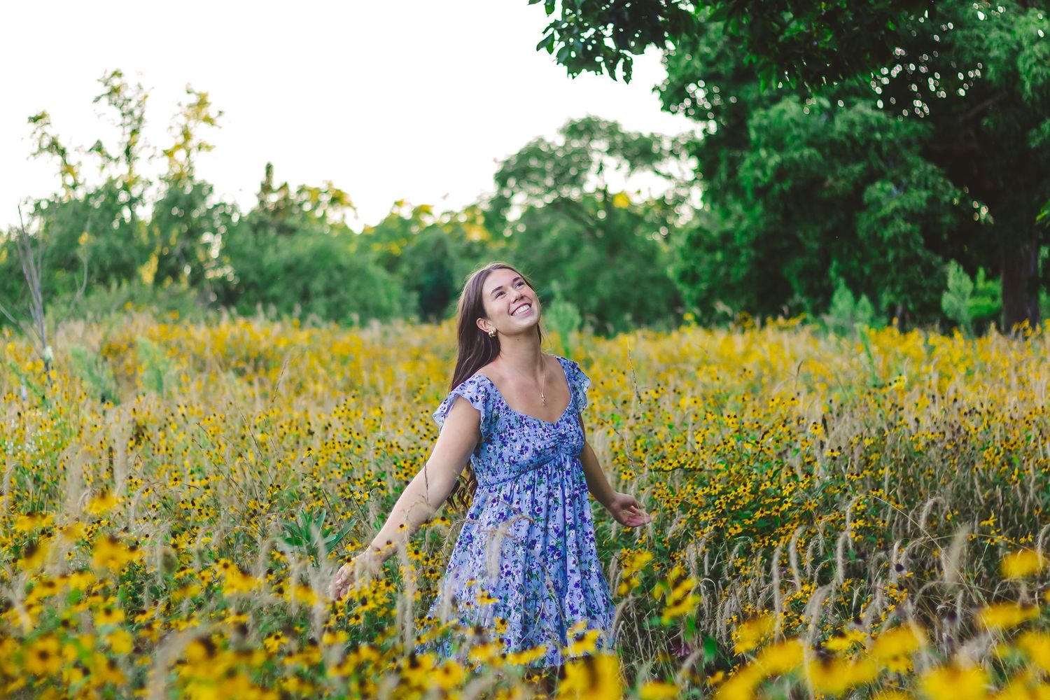 Candid family moments captured in a field of yellow wildflowers during summer.