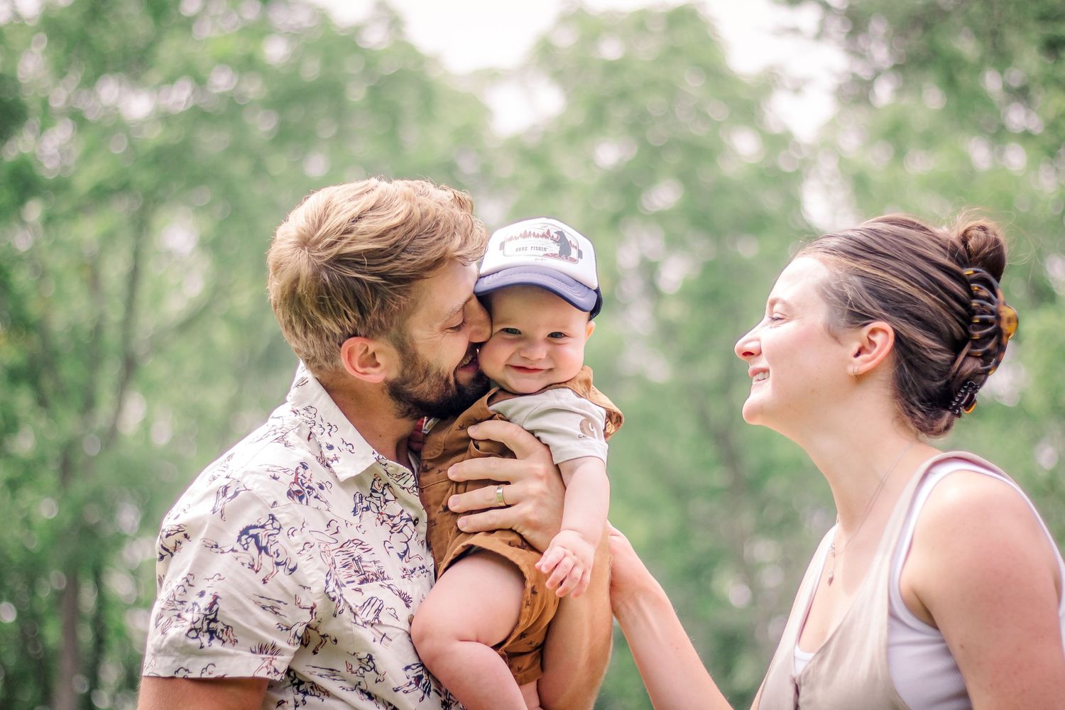 A series of tender outdoor family moments captured in a natural setting during a photo session at Delafield home session